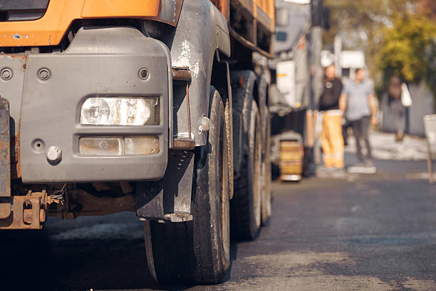 istock Public city street reconstruction with heavy machines. 2233651388