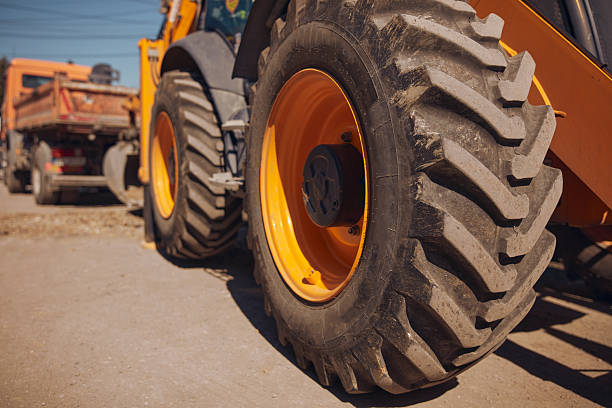 istock Public city street reconstruction with heavy machines. 2233651412