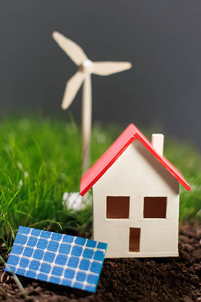 istock Miniature house surrounded by renewable energy sources 2233653507