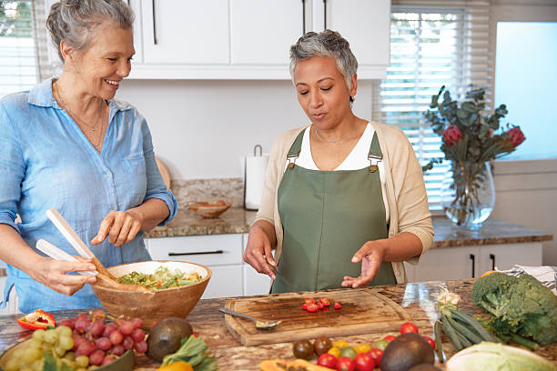 istock Friends Preparing Lunch Together in Kitchen 2233653939