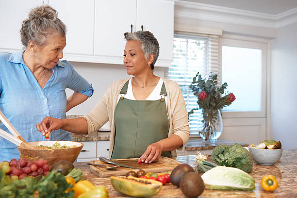istock Friends Preparing Lunch Together in Kitchen 2233654056