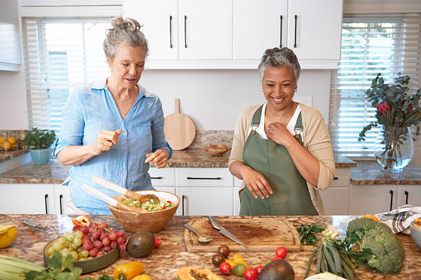 istock Friends Preparing Lunch Together in Kitchen 2233654265