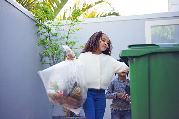 istock Kids Taking Out the Trash and Recycling 2233654594