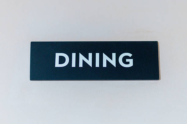 istock dining sign displayed on a black plastic surface, indicating the area for meals in a restaurant or cafÃ© setting 2233656159