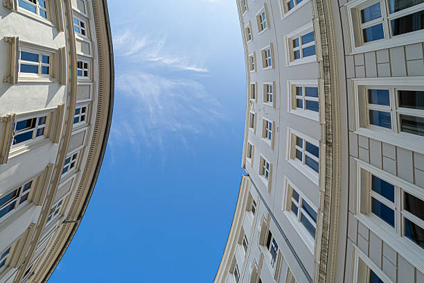 Germany, Hamburg, Neustadt, August 08, 2025 - Round residential buildings against the sky