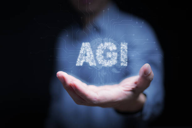 istock Human hand holding glowing AGI letters with circuit patterns, symbolizing Artificial General Intelligence, advanced AI, machine learning, and the innovative future of intelligent digital technology. 2233658528