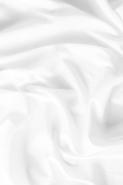 istock Soft and Elegant White Silk Fabric with Fluid Creases and Textures 2233663893
