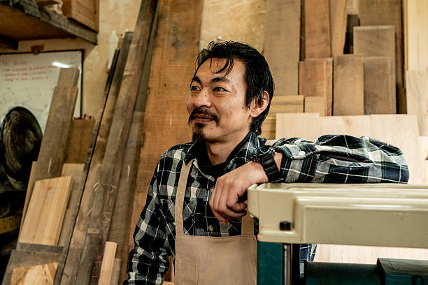 Carpenter contemplating in a workshop