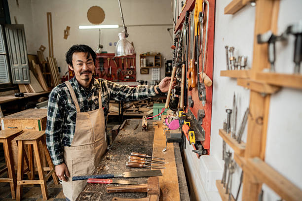 istock Portrait of a mature carpenter using work tools in a workshop 2233666289