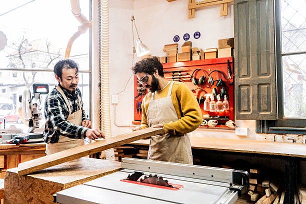 Carpenters repairing wood in a workshop