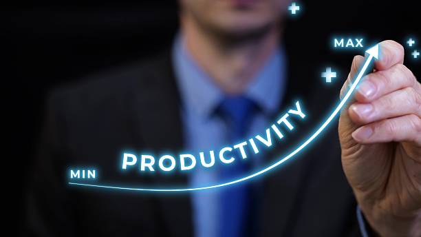 Businessman drawing rising productivity at work graph from minimum to maximum