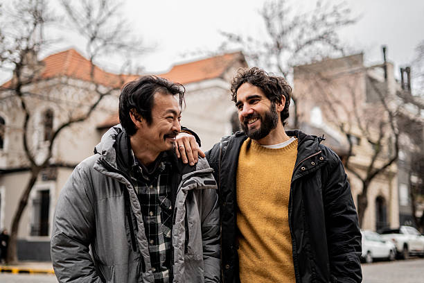 istock Friends talking on the street 2233667225