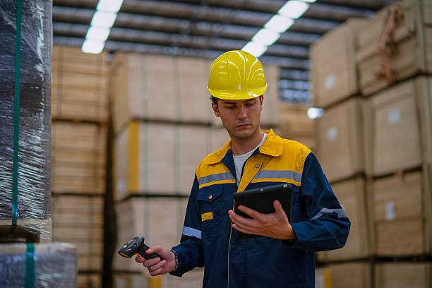 istock Blue collar worker is working at wood factory. 2233670471