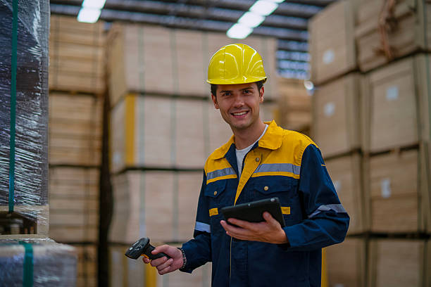 istock Blue collar worker is working at wood factory. 2233670472
