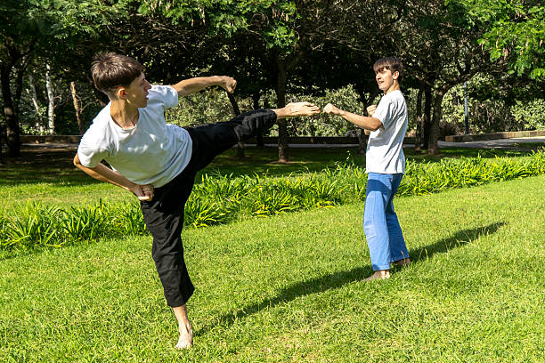 istock Focused martial arts practice in a green setting 2233673772