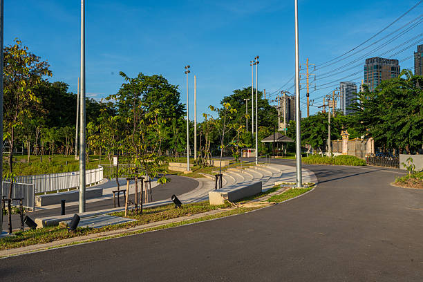 istock Walk and run pathway pavement asphalt road in city green tree pak 2233674815