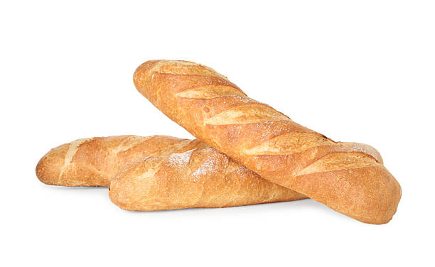 istock Three freshly baked baguettes isolated on white 2233675099