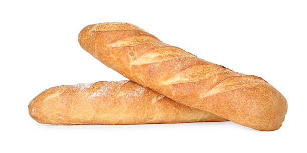 istock Two freshly baked baguettes isolated on white 2233675283