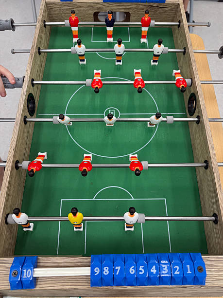 istock FOOSBALL MINIATURE FOOTBALL GAME BOARD 2233675948