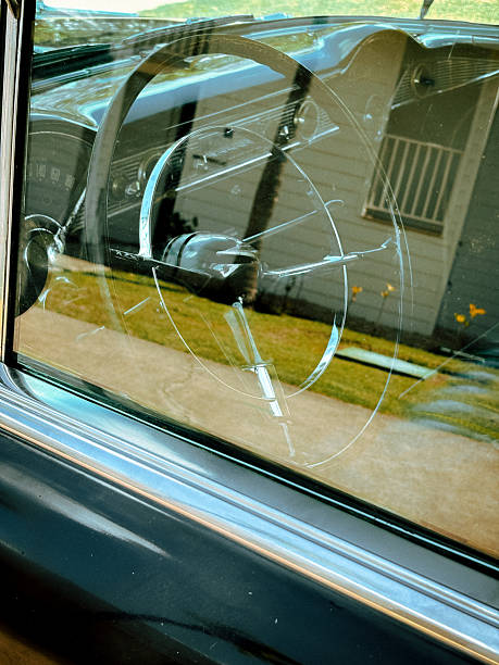 istock Steering Wheel of a Vintage Car Through a Window 2233676133