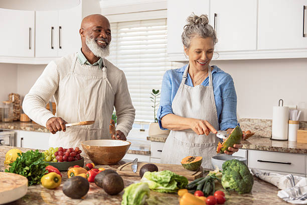 istock Mature Couple Making Healthy Salad Together in Kitchen 2233676752