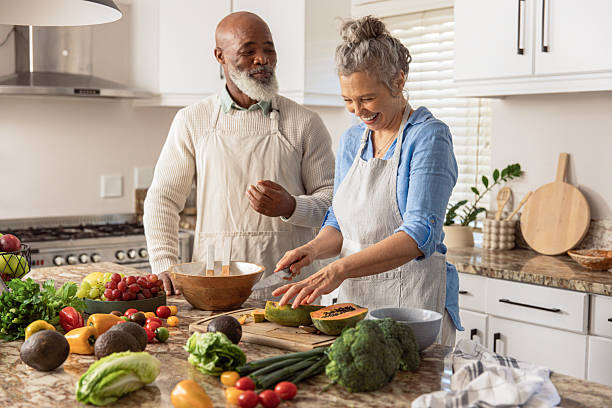 istock Mature Couple Making Healthy Salad Together in Kitchen 2233676826