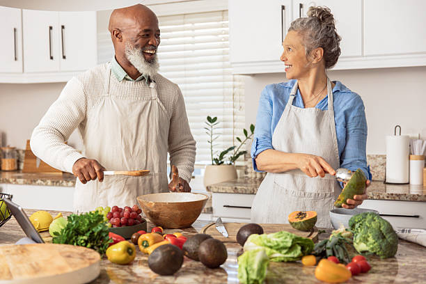 istock Mature Couple Making Healthy Salad Together in Kitchen 2233676829