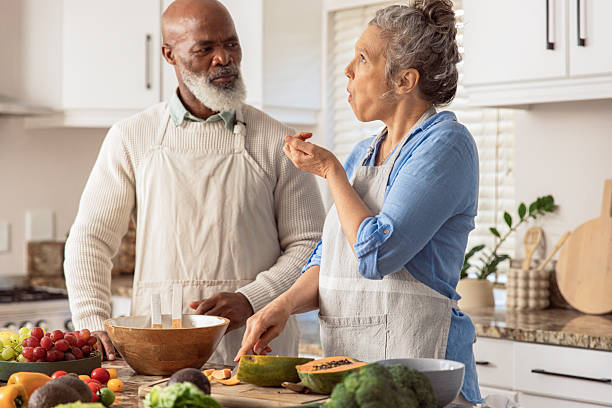istock Mature Couple Making Healthy Salad Together in Kitchen 2233676908