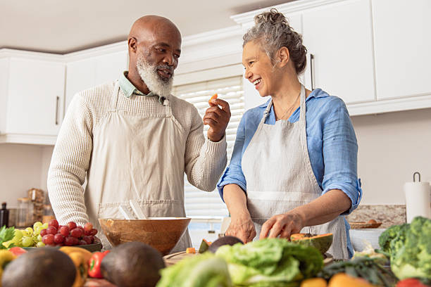 istock Mature Couple Making Healthy Salad Together in Kitchen 2233676965