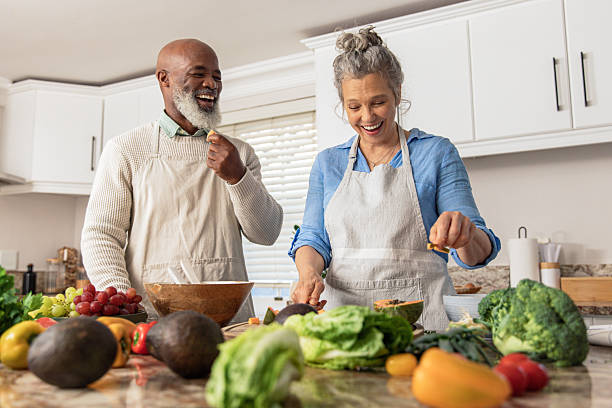 istock Mature Couple Making Healthy Salad Together in Kitchen 2233676969