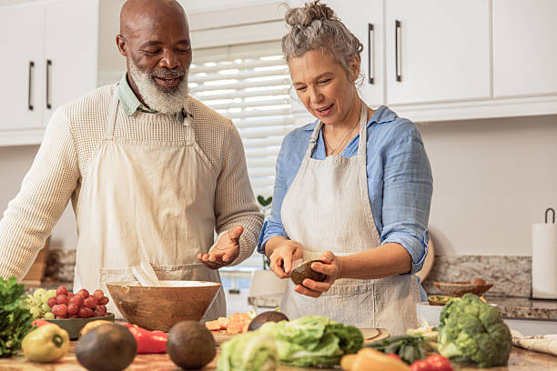 istock Mature Couple Making Healthy Salad Together in Kitchen 2233677068
