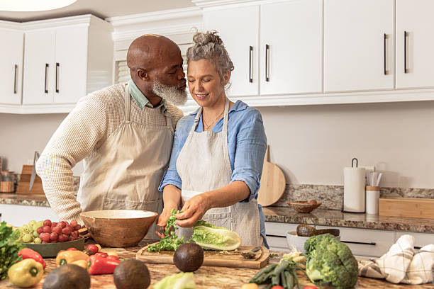 istock Mature Couple Making Healthy Salad Together in Kitchen 2233677162