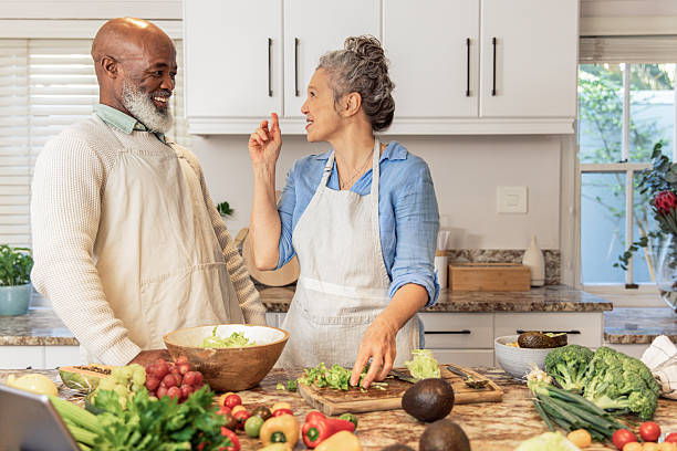 istock Mature Couple Making Healthy Salad Together in Kitchen 2233677270