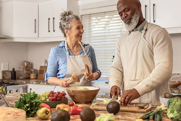 istock Mature Couple Making Healthy Salad Together in Kitchen 2233677493
