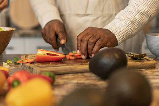 istock Close-Up of Hands Preparing Fresh Salad 2233677593