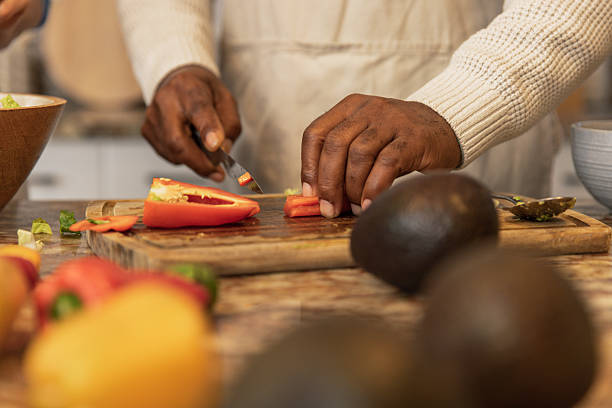 istock Close-Up of Hands Preparing Fresh Salad 2233677596