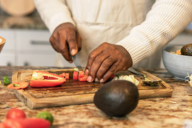 istock Close-Up of Hands Preparing Fresh Salad 2233677663