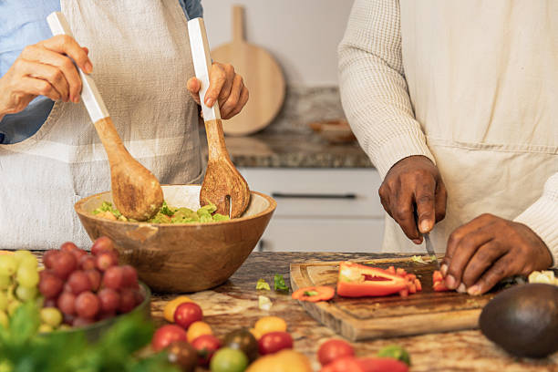 istock Close-Up of Hands Preparing Fresh Salad 2233677697