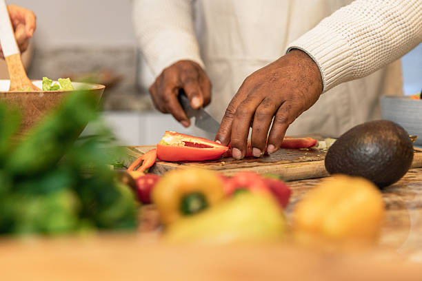 istock Close-Up of Hands Preparing Fresh Salad 2233677712