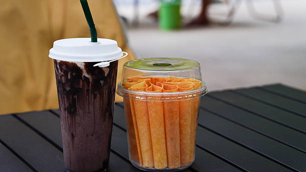 Iced cocoa and snacks are placed on the table.