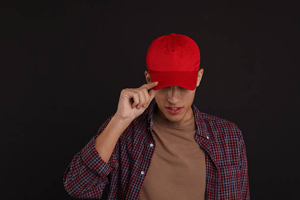 istock Man in stylish baseball cap on black background. Mockup for design 2233678305