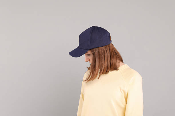 istock Woman in stylish baseball cap on grey background. Mockup for design 2233678321