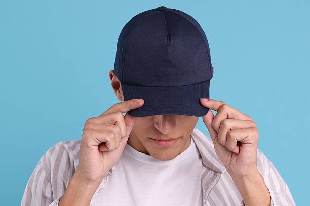istock Man in stylish baseball cap on light blue background. Mockup for design 2233678330