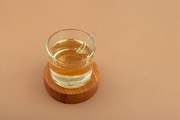 istock Food Additive E433. Polyoxyethylene (20) sorbitan monooleate or Polysorbate 80 in glass cup.  Emulsifier and stabilizer. Versatile additive used wherever water-oil mixing. Texture enhancer 2233678435