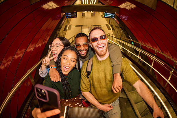 istock Group of diverse friends taking a selfie on an escalator 2233679803