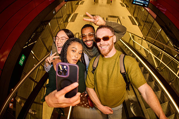 istock Group of diverse friends taking a selfie on an escalator 2233679809