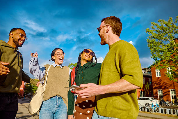istock Gen z students embracing on the street and smiling 2233679816