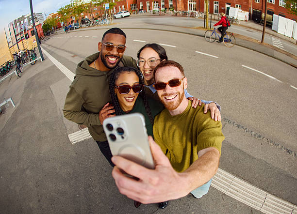 istock Group of gen z friends taking a selfie while commuting 2233679818