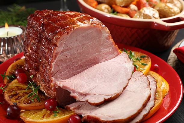 istock Tasty baked ham served on black table, closeup 2233680579