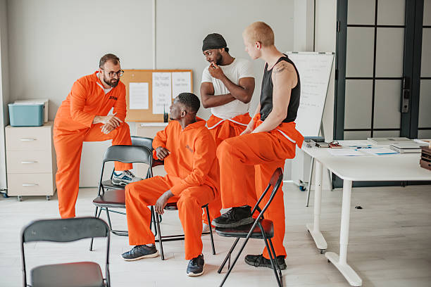 istock Prison education program fostering teamwork and motivation among diverse group of young adults engaged in serious learning 2233682532